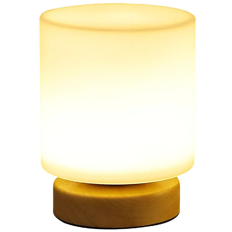 Nordic USB table lamp with geometric white light and solid wood decoration on bedside table