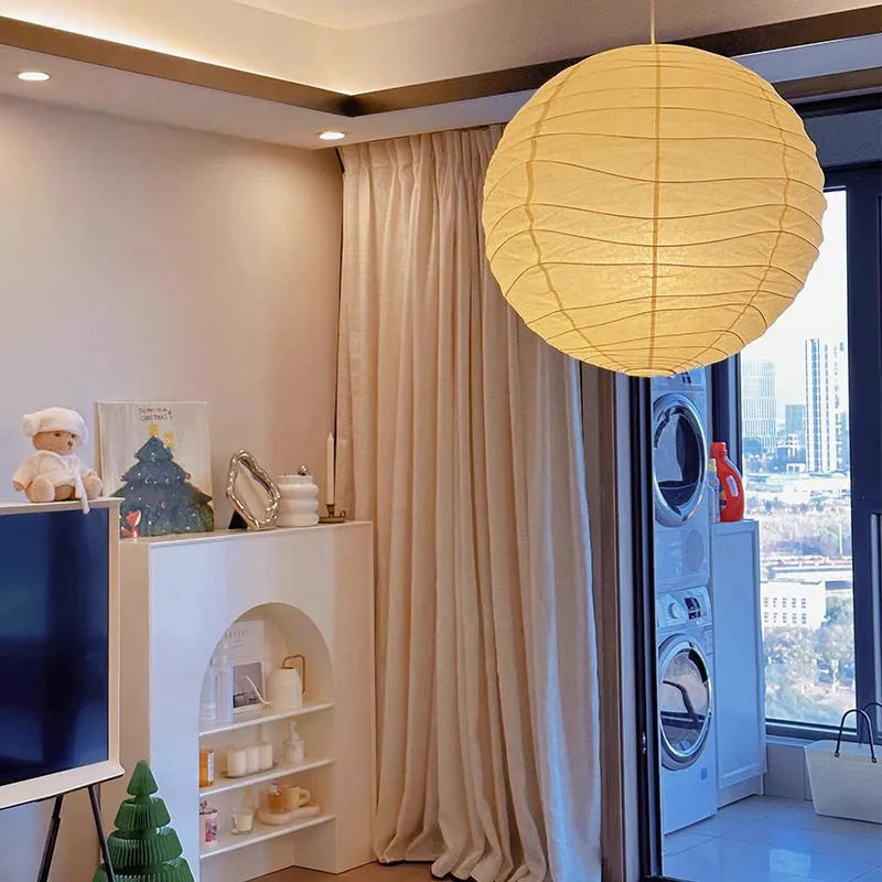 Japanese rice paper chandelier in living room setting with soft ambient lighting