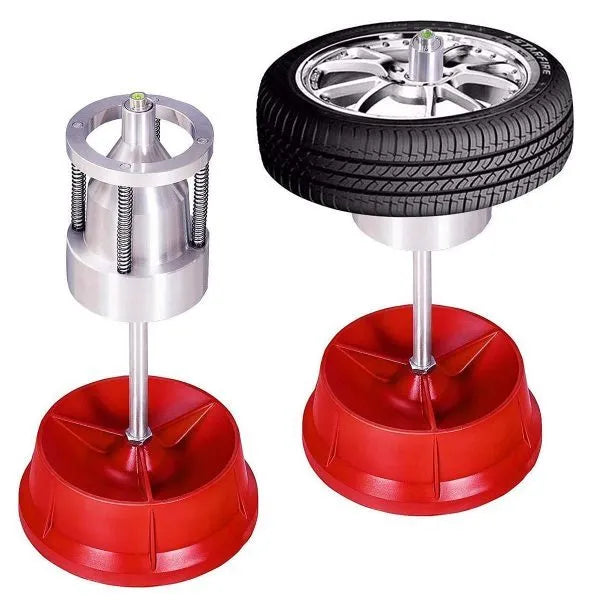 Portable aluminium hub balancer for car wheels with a bull's eye level and enamel-finished base.