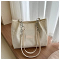 Corduroy women's tote handbag with one-shoulder strap and three-dimensional pocket in horizontal square shape