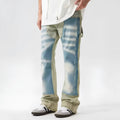 Yellow and blue retro patchwork splash-ink damaged design jeans with a zip fly.