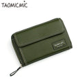 Women's crossbody shoulder bag with zippered closure and adjustable strap in blackish green colour