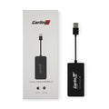 Black wireless CarPlay USB dongle for connecting iPhone to Android car stereo.