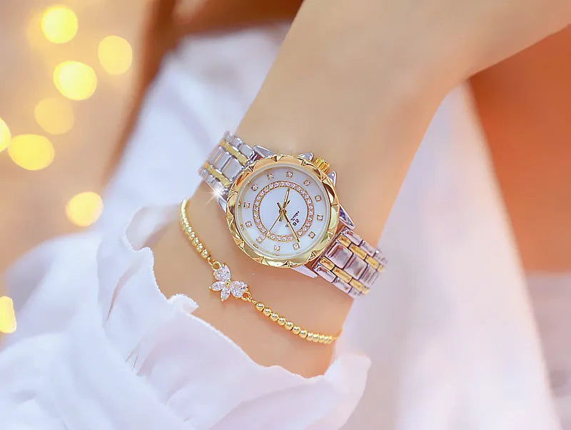 Women's quartz watch with 32mm round dial, alloy case, and mineral glass in a choice of gold or silver finishes