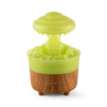 Wood grain white column-shaped rain cloud humidifier diffuser with LED night light on a table.
