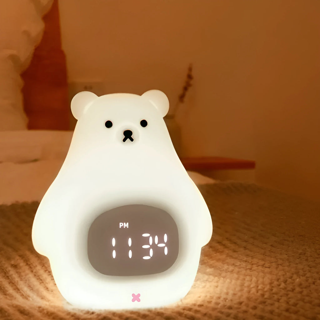 Big White Bear shaped silicone night light with soft glow and remote control on a bedside table.