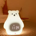 Big White Bear shaped silicone night light with soft glow and remote control on a bedside table.