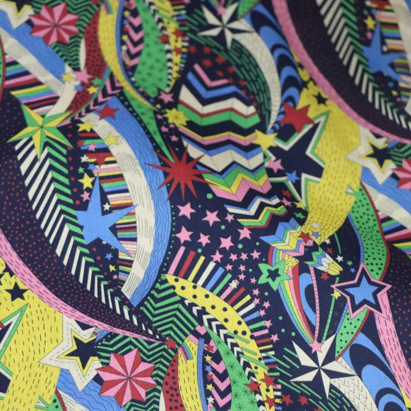Blue plant and flower pattern on 100% cotton fabric, showing the 145 cm width.
