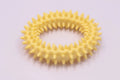 Blue TPR spiky ring dog chew toy for dental cleaning and bite training on a white background.