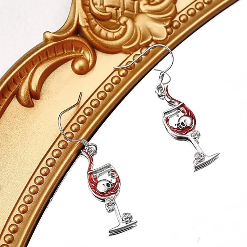 Silver tone zinc alloy Halloween earrings with a combined skull and wine glass geometry design.
