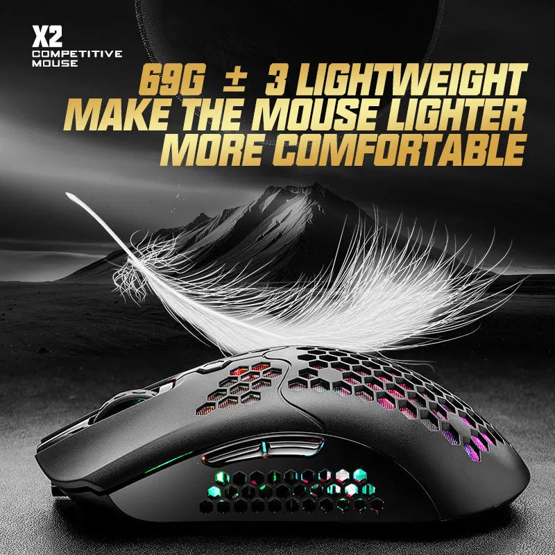 Free Wolf X2 wireless gaming mouse in black on a mouse mat, showing RGB lighting and USB-C cable.