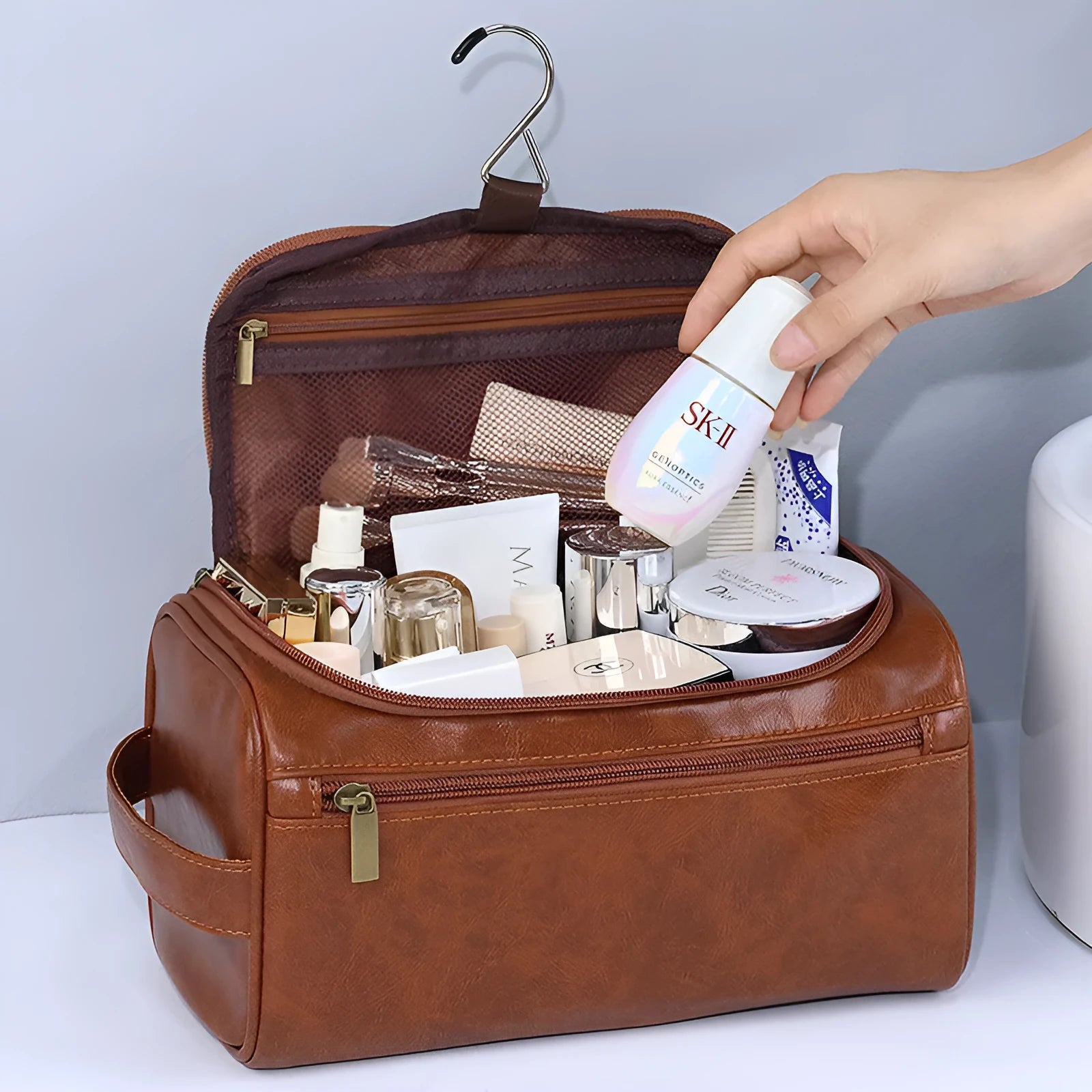 Large waterproof cosmetic bag in retro style, shown in brown PU leather and navy blue Oxford cloth options.