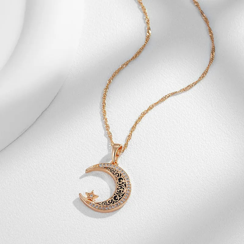 Rose gold coloured necklace with star and moon pendant on water wave chain
