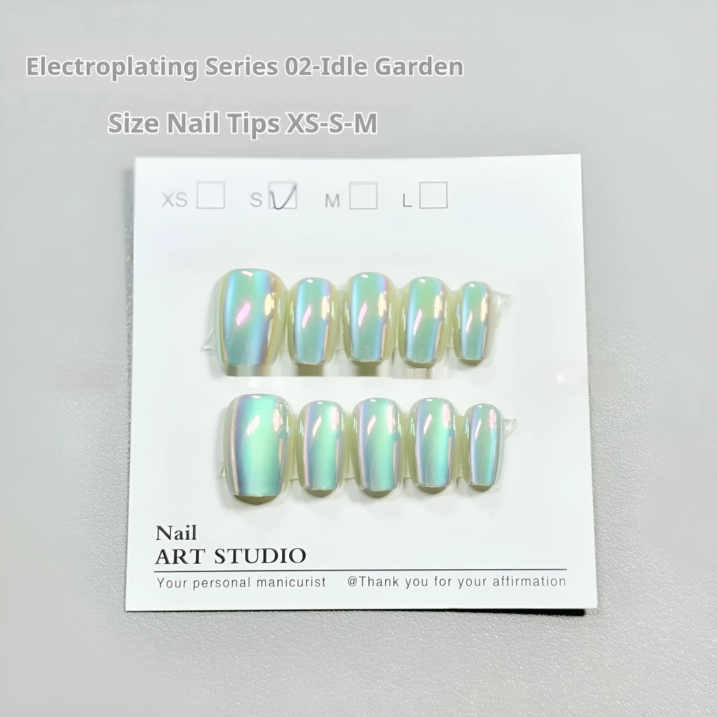 Set of false nails with electroplated cat's eye and aurora design on short ladder shaped tips.