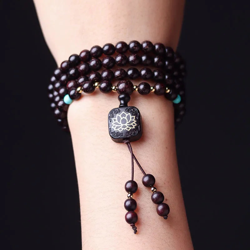 Zambia Rosewood 108-bead bracelet with flat lotus pendant on neutral background