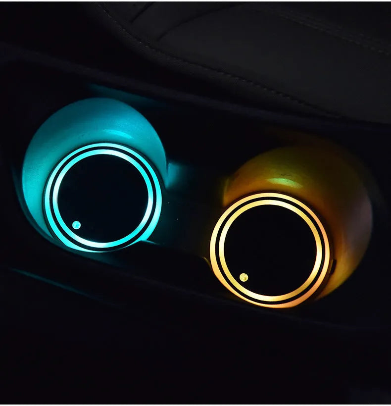 Colourful LED light-up coaster for a car cup holder showing multiple light colours on a 68mm acrylic and ABS mat.
