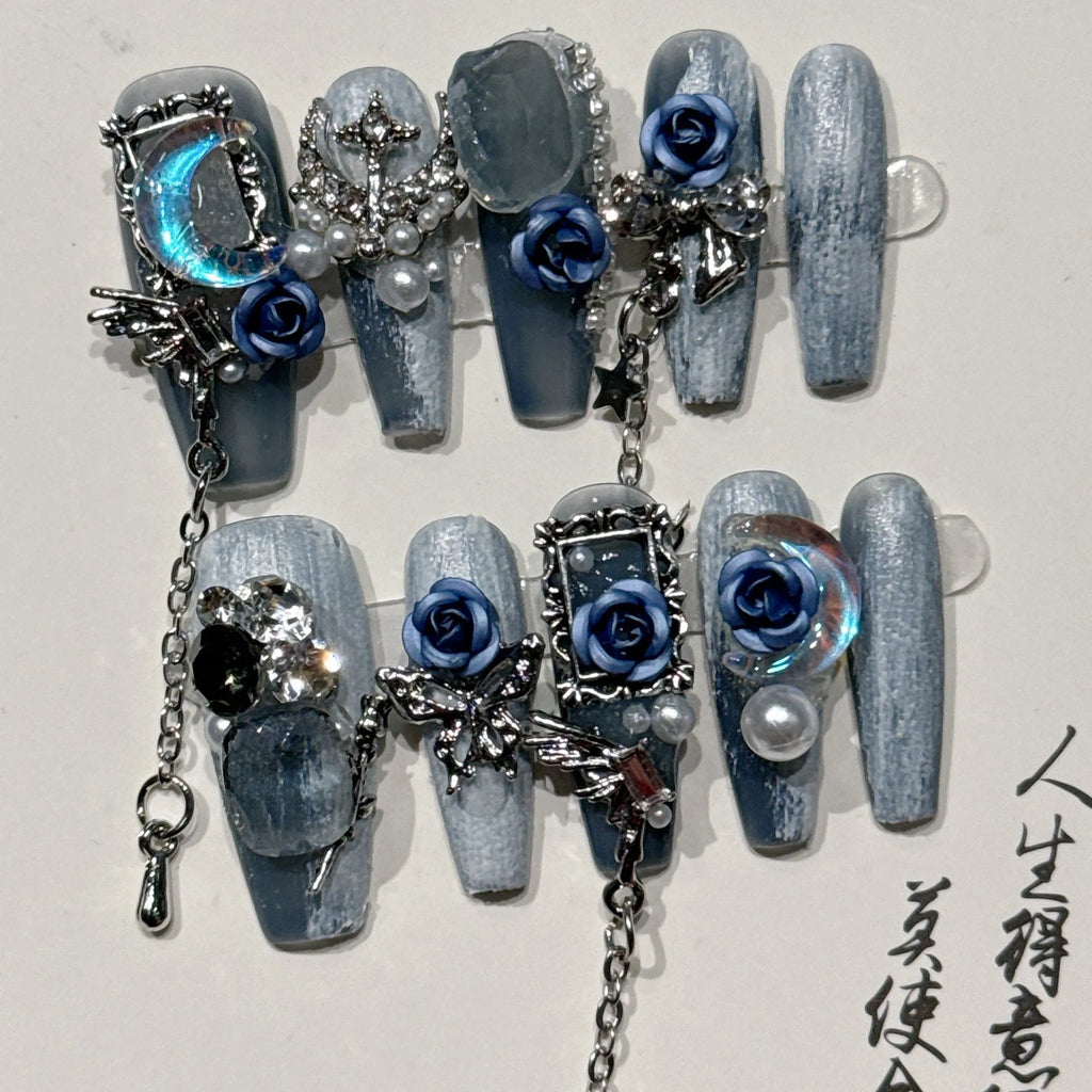 Heavy industry blue night manicure set with rose and tulip floral designs on plastic armour suit.