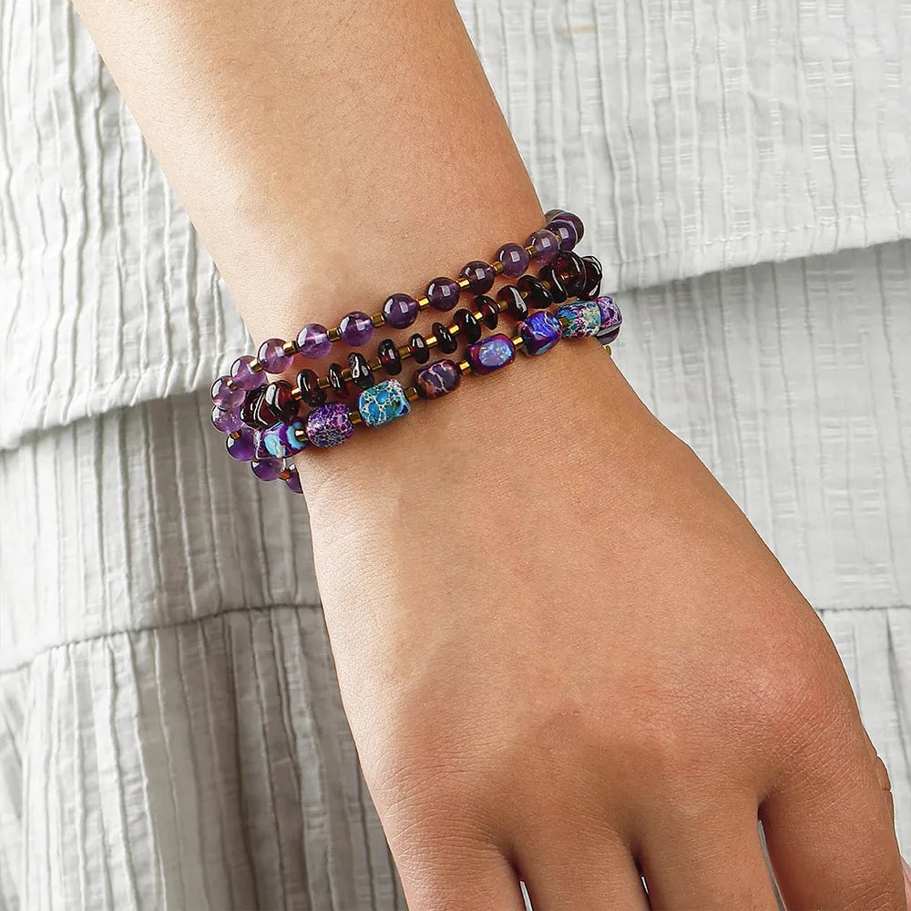 Purple amethyst and garnet round stone bead bracelet with geometric shapes