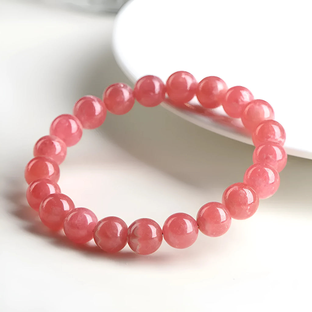 Women's geometric design crystal bracelet with natural red rhodochrosite stones and longevity lock fastening