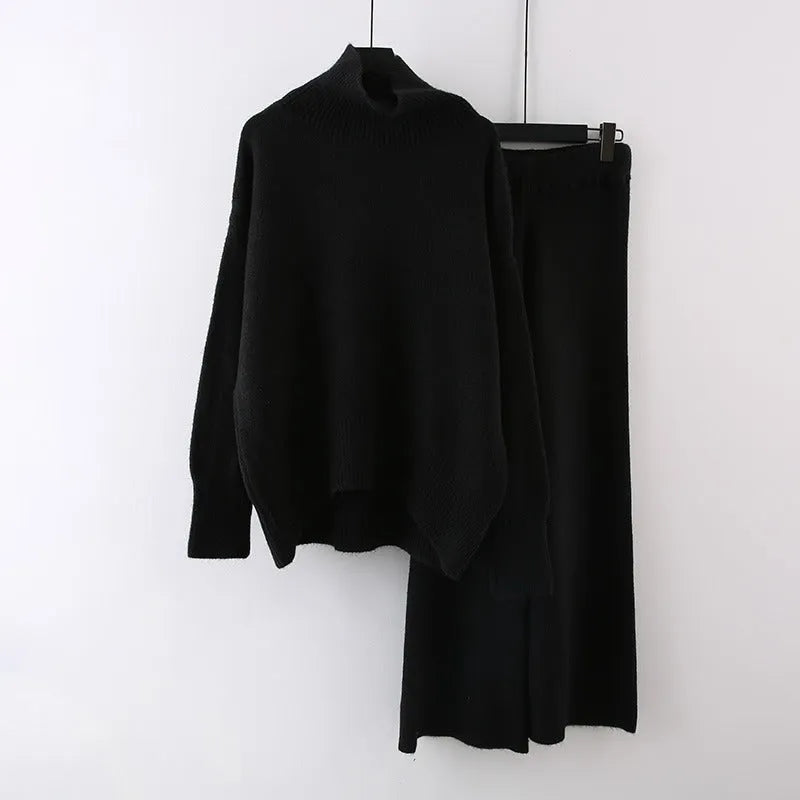 Women's beige acrylic knit long-sleeve sweater and matching wide-leg trousers set on a hanger.