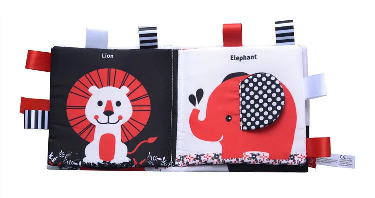 Four cloth books with bird, snail, zebra, and ABC designs featuring haha mirror and rattle functions
