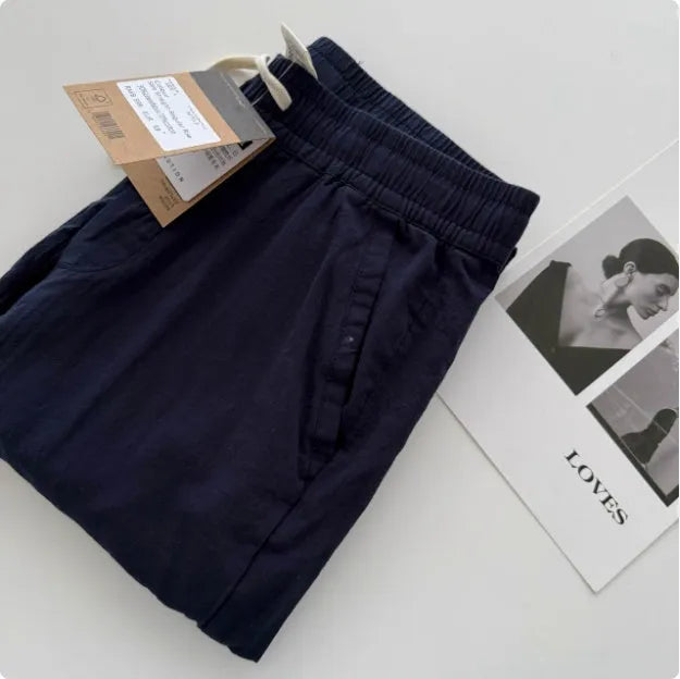 Men's lightweight casual trousers with drawstring waist in loose straight fit showing colour options