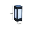 Set of solar-powered LED garden lights in different styles mounted on a garden wall and path