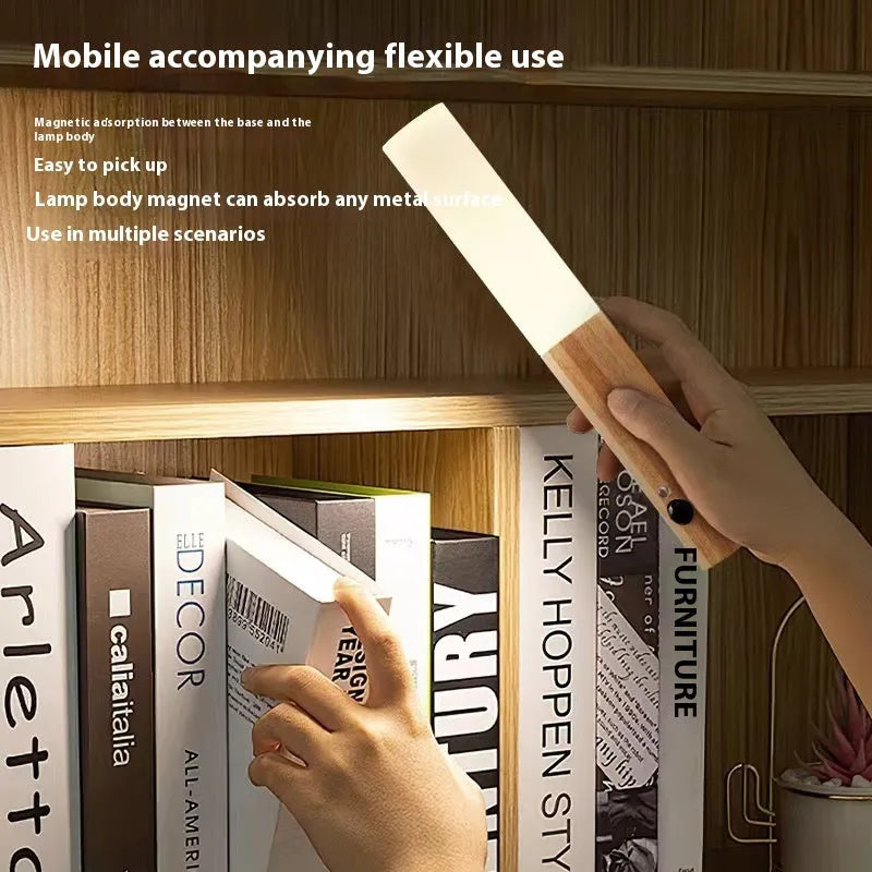 LED wood grain magnetic wall lamp with motion sensor in dark finish on wooden wall
