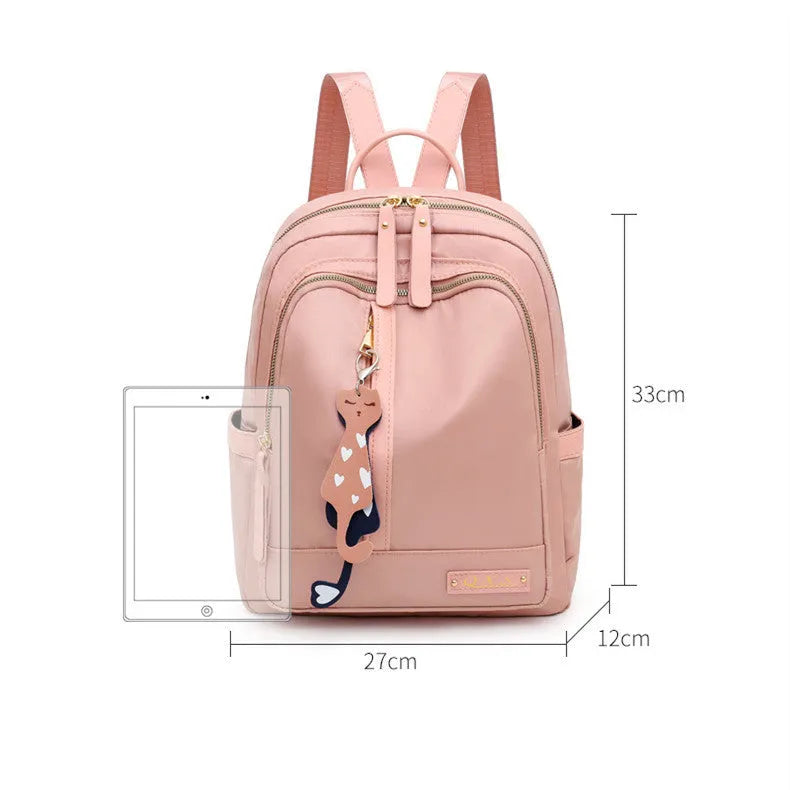 Soft black nylon women's casual backpack with double straps, external pocket, and internal organisers.