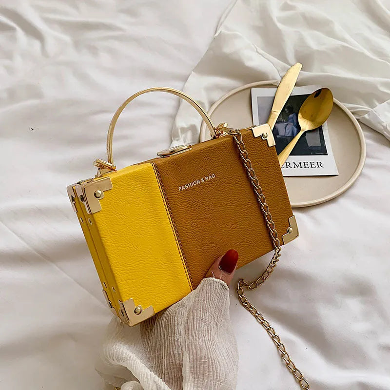 Handle box design clutch bag in orange with long chain, PU leather, 19cm length