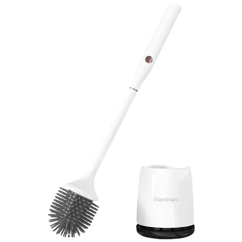 White wireless electric toilet brush with base and USB cable on a bathroom floor