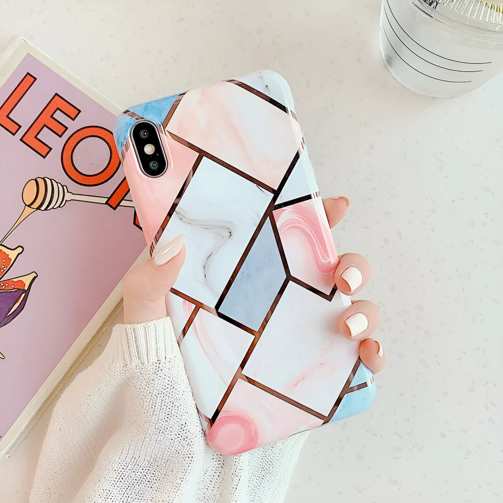 Flexible silicone gel mobile phone case for various iPhone models on a table.