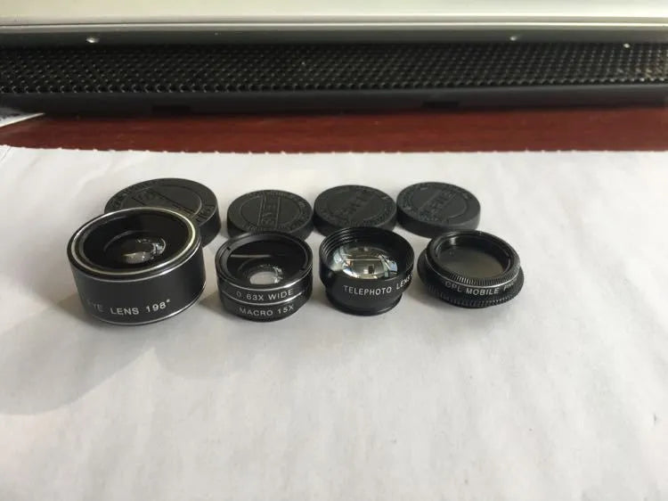 Five-in-one mobile phone lens kit with fisheye wide angle macro telephoto and CPL lenses on a black background
