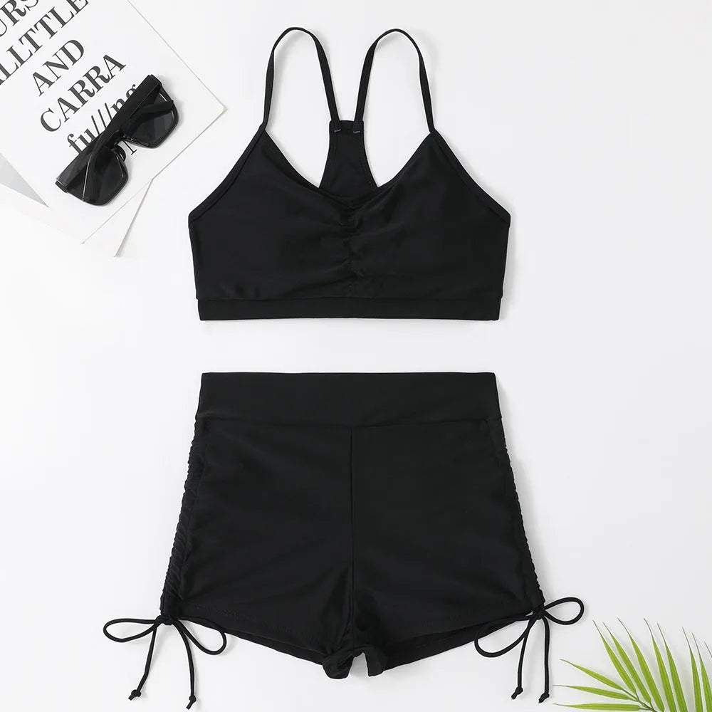 Women's high waist split bikini swimsuit in black or purple, made from nylon and spandex.