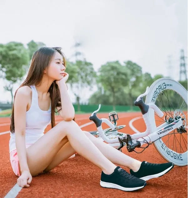 Women's breathable mesh flat heel sports shoes available in black, pink, and rose red colours