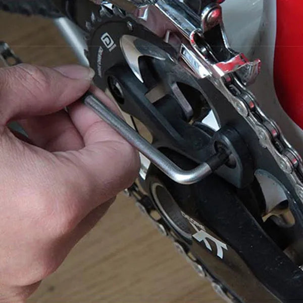 Stainless steel bicycle repair combination tool with 23 functions on a grey background
