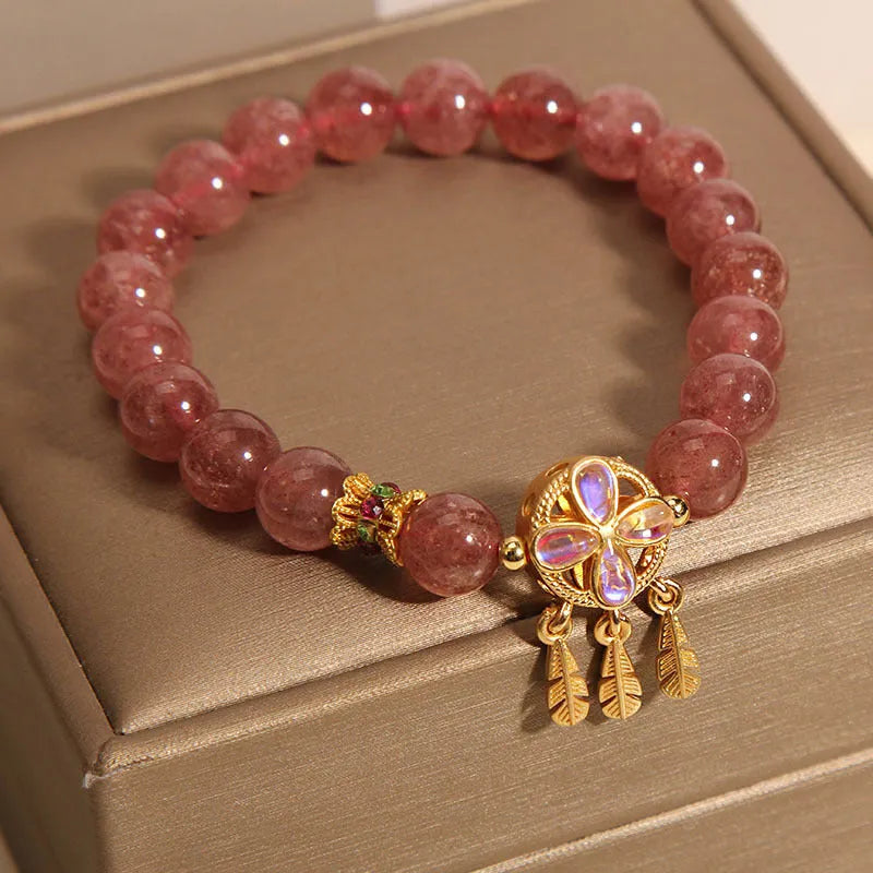 Women's crystal bracelet with strawberry quartz four-leaf dream catcher ball pendant