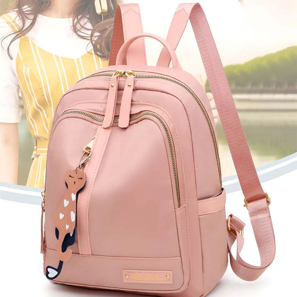Soft black nylon women's casual backpack with double straps, external pocket, and internal organisers.