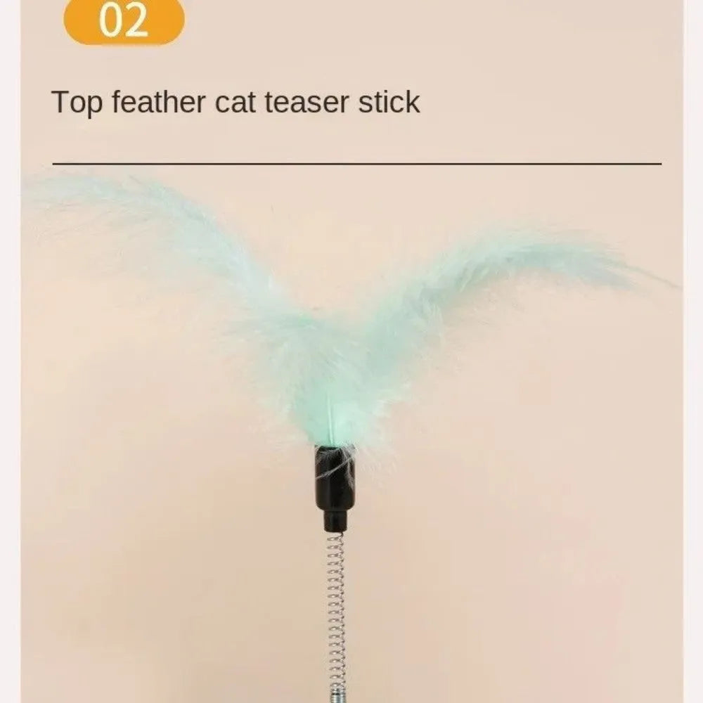 Cat food dispensing turntable toy in green with stick, plastic construction, for indoor cats