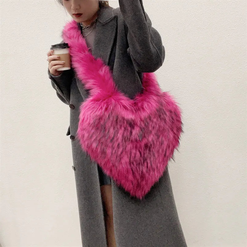 Women winter fleece heart shape crossbody bag with plush exterior, tassel detail, and large capacity