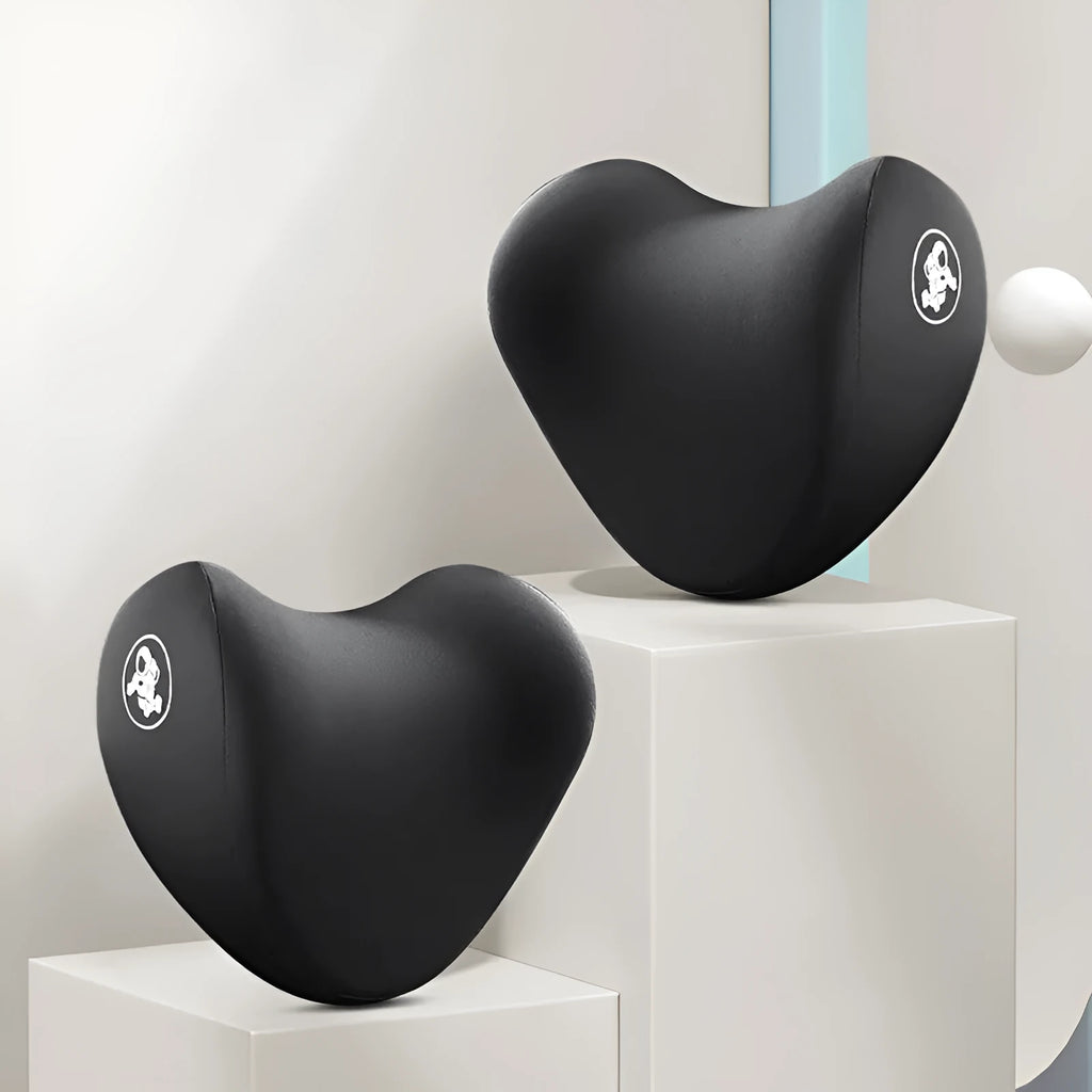 Heart-shaped car pillow in choice of colours, shown as headrest and lumbar support on a car seat.