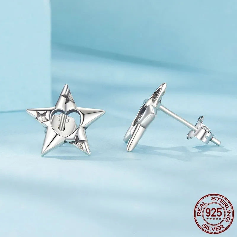 S925 sterling silver hollow pentagram star stud earrings, polished finish, SCE1886 colour, on white background