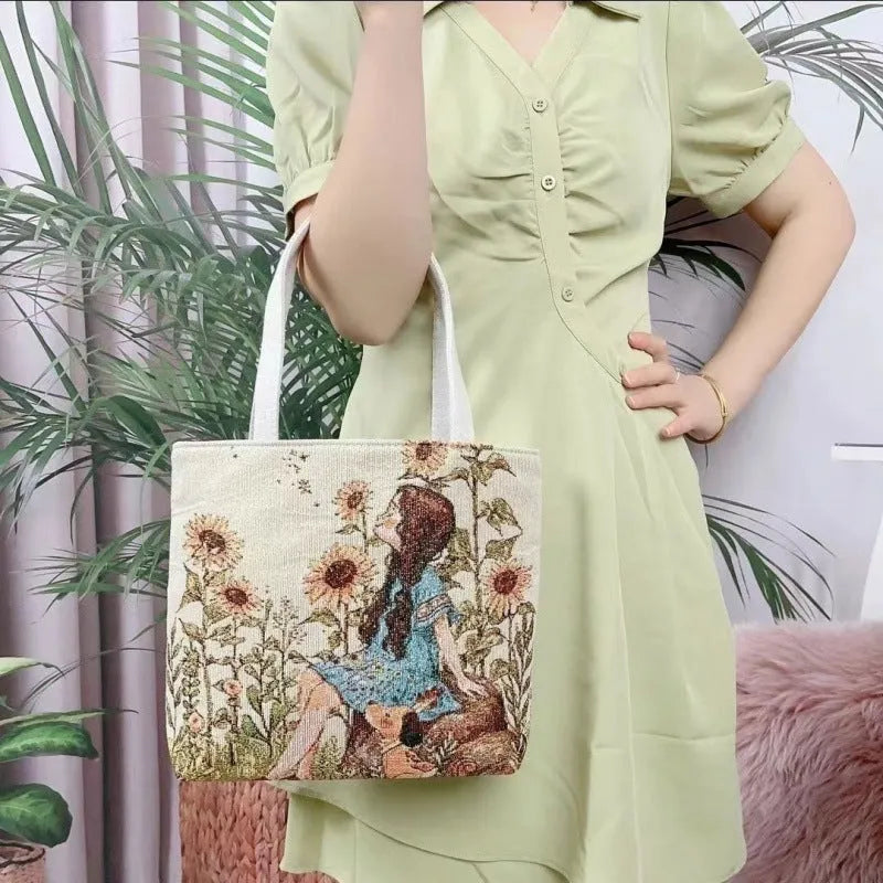 Double-sided embroidered canvas tote bag with gold wire trim, shown in a selection of seven colourways.