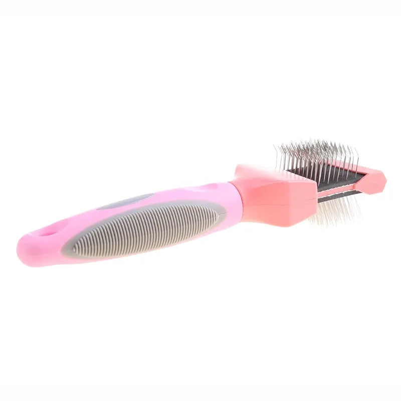 Double-sided stainless steel pet brush for dogs and cats in blue or pink with ergonomic handle
