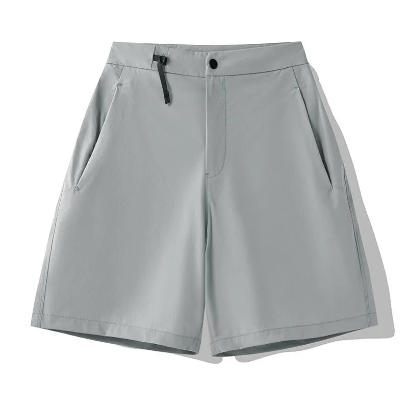 Men's solid colour sports shorts with 3D cut and stretch fabric for running.
