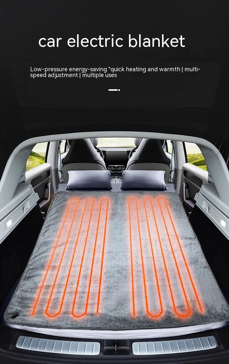 Grey 12v car electric blanket with power cord and controller on a car seat.