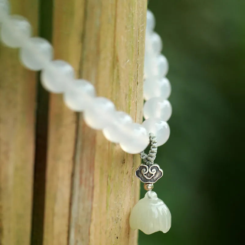 White agate and Hetian jade beads on a geometric S925 sterling silver lotus bracelet for women.