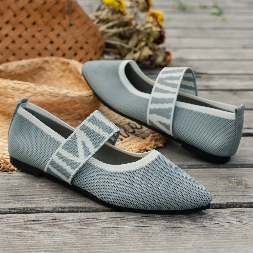 Women's pointed toe flat loafers in mesh upper with rubber sole, side view