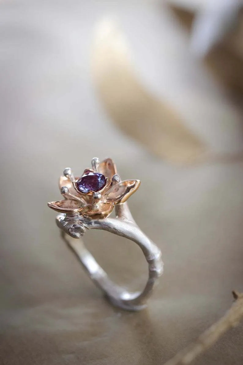Silver two-tone floral geometric women's fashion ring made from alloy.