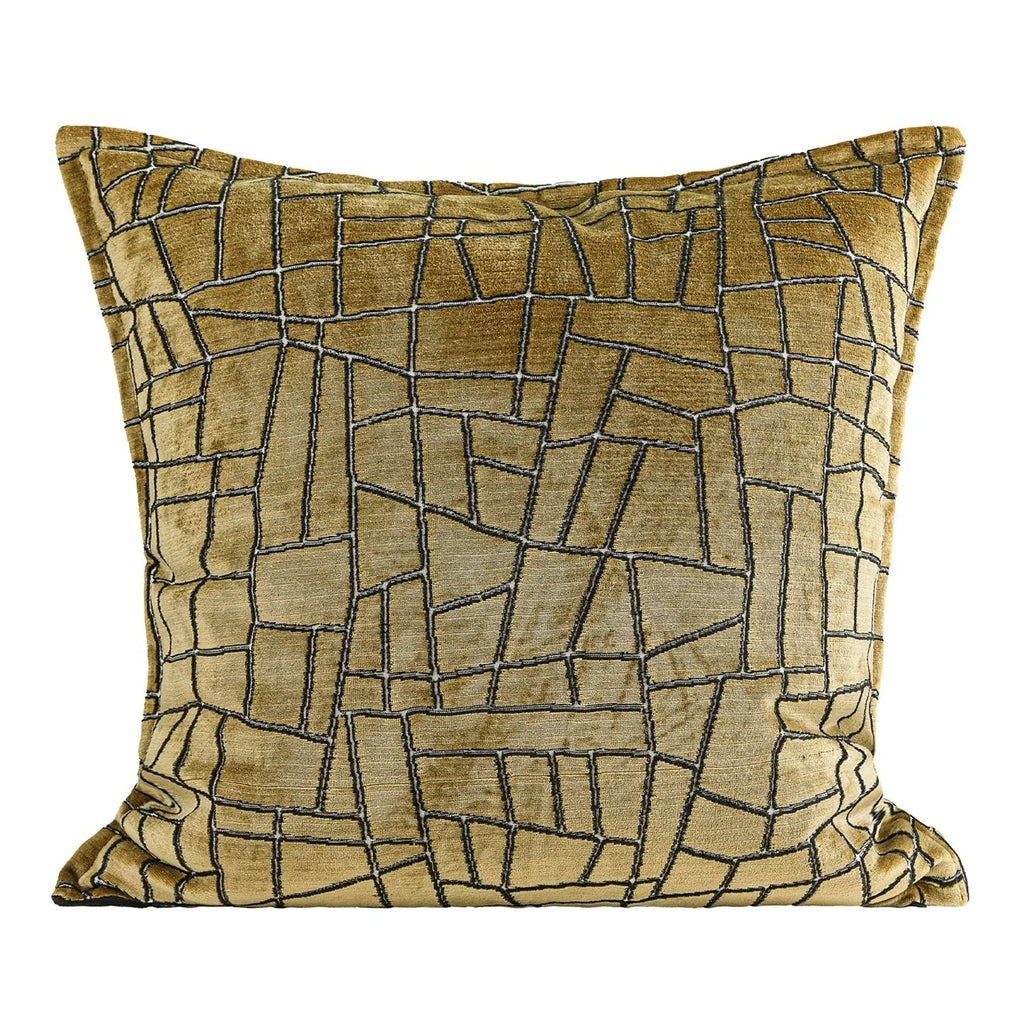 Geometric abstract patterned cushion cover in gold colour on a grey sofa, showing three size options.